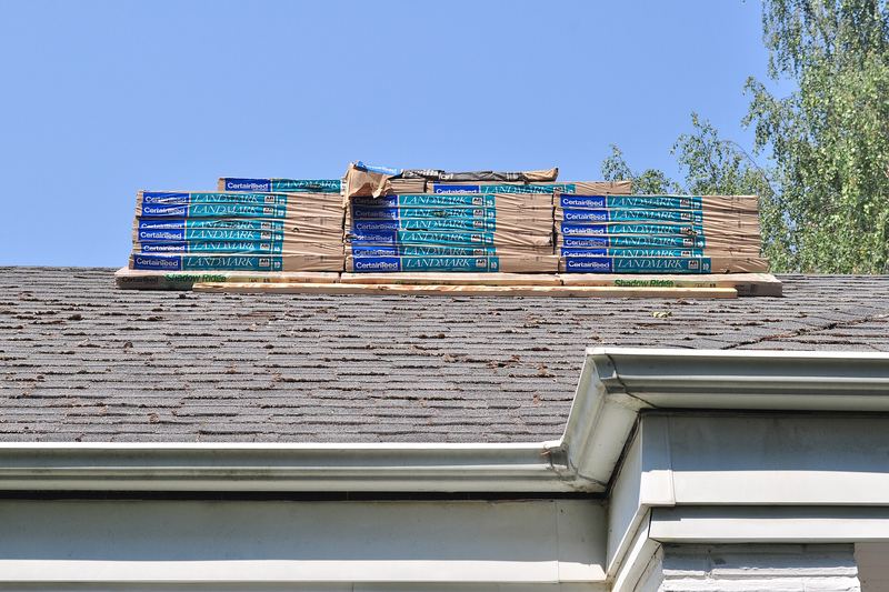Bundles of shingles staged on a roof
